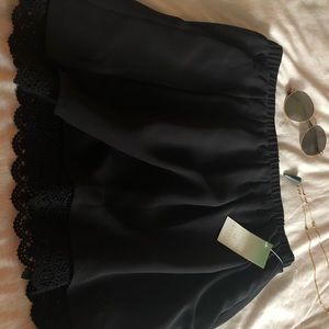 black mini skirt by Decree